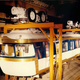 Illustration for article titled I Want to Live Inside This 1960 Painting of a Monorail Station